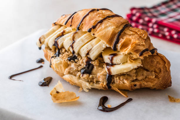 Croissant Sandwich with Banana, Peanut Butter and Chocolate Sauce.