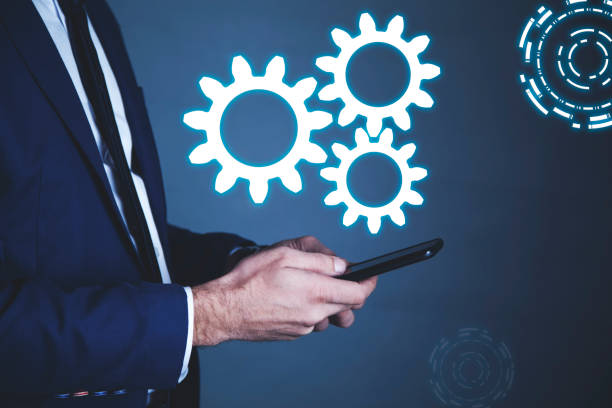 istock Business man hand phone with gear 1132784494