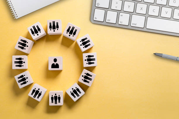 istock many people gathering around a leader symbolized by icons on cubes 1132786008