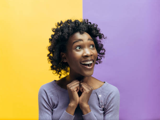 istock Winning success woman happy ecstatic celebrating being a winner. Dynamic energetic image of female afro model 1132787243