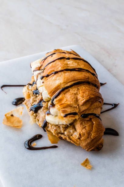 Croissant Sandwich with Banana, Peanut Butter and Chocolate Sauce.