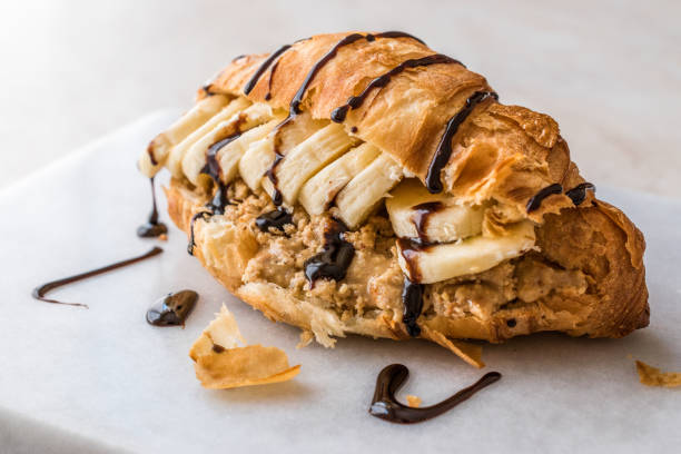 Croissant Sandwich with Banana, Peanut Butter and Chocolate Sauce.