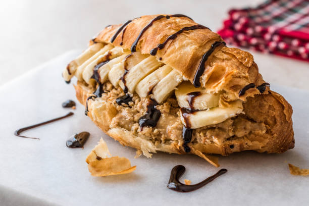 Croissant Sandwich with Banana, Peanut Butter and Chocolate Sauce.