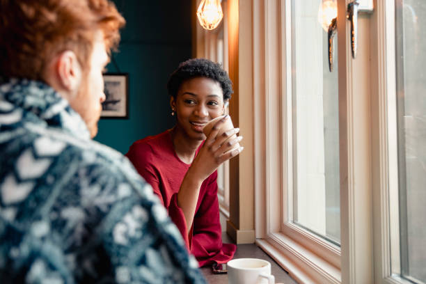istock Friends Talking in a Cafe 1132789129