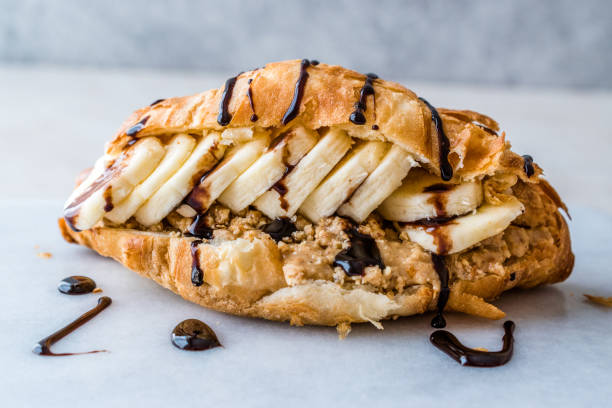 Croissant Sandwich with Banana, Peanut Butter and Chocolate Sauce.