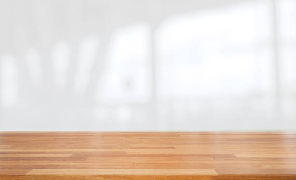 istock Beautiful empty wood table against abstract blur white interior background 1132790172