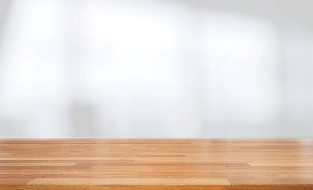 istock Beautiful empty wood table against abstract blur white interior background 1132790178