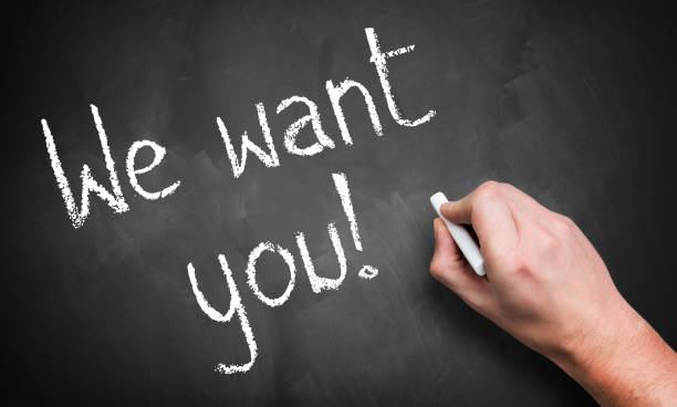 istock hand writing 'We want you!' on a chalkboard 1132790289