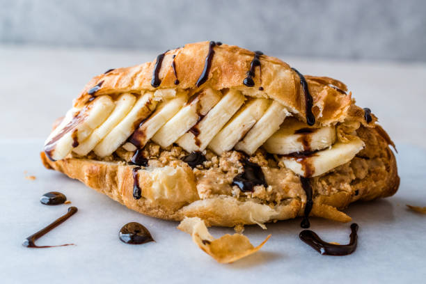 Croissant Sandwich with Banana, Peanut Butter and Chocolate Sauce.