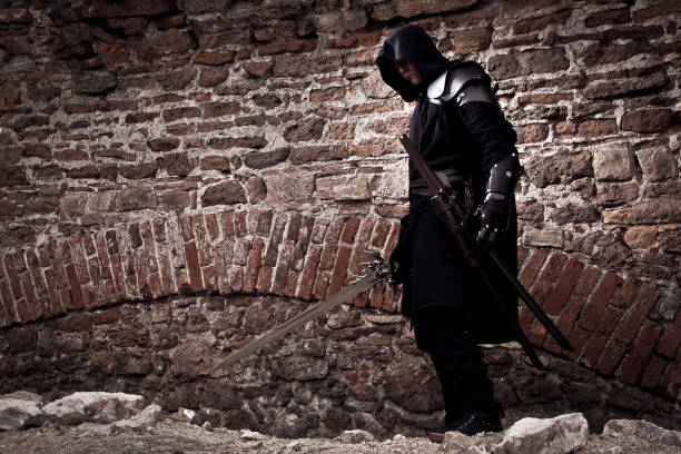 istock Warrior standing in forgotten and ruined fortress. 1132790661