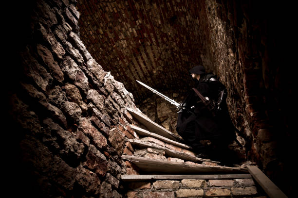 istock Warrior standing in forgotten and ruined fortress. 1132790842
