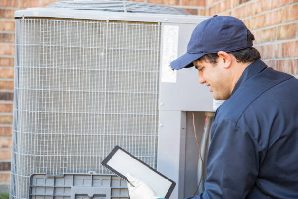 istock Blue collar air conditioner repairman at work. 1132791605