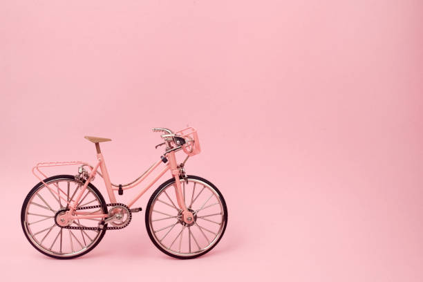istock Pink vintage bicycle on pink background. pastel minimal style concept. 1132792201