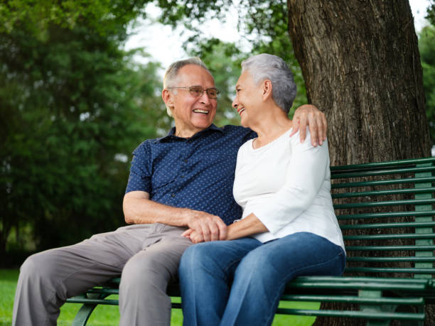 istock Cheerful retired couple on a bench 1132793155