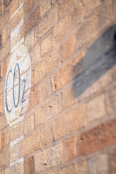 istock Weathered painted sign on a brick wall warning of CO2 outlet 1132793517