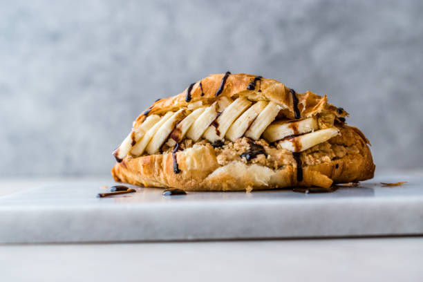 Croissant Sandwich with Banana, Peanut Butter and Chocolate Sauce.