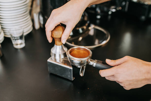 istock Human hands making fresh espresso coffee drink 1132794715