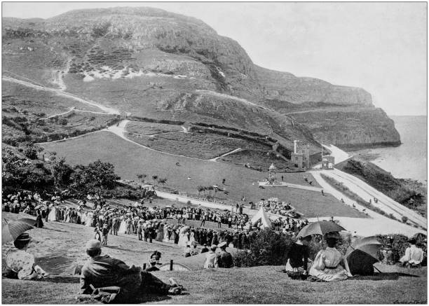 illustrations, cliparts, dessins animés et icônes de photographie noir et blanc antique de l'angleterre et du wales: happy valley et la tête de great orme, llandudno - gwynedd