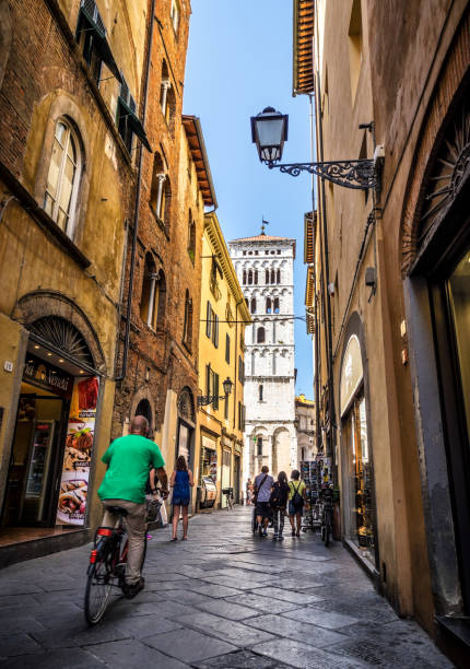 Tuscany streets of Lucca Lucca, Italy - August 2, 2017: Tourists and locals in the streets of Lucca. Tuscany lucca italy stock pictures, royalty-free photos & images