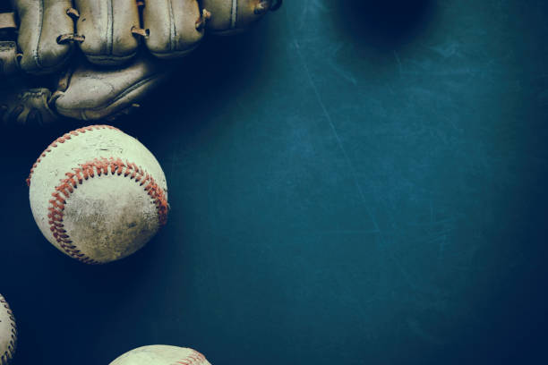 Baseball grunge background with ball and glove. Old baseball with glove flat lay on grunge background with copy space for sports team season. baseball stock pictures, royalty-free photos & images