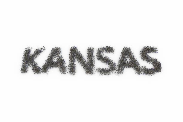 istock Large group of people standing together forming KANSAS 1132797638