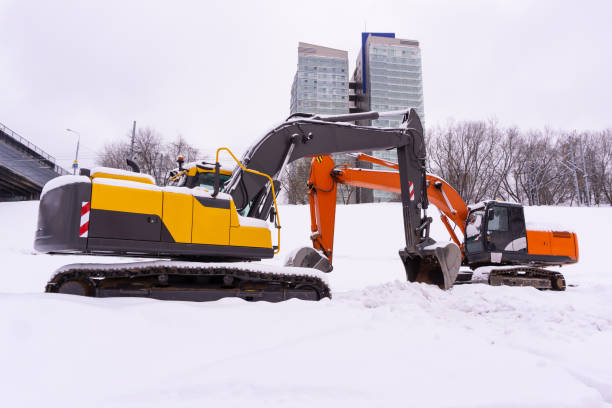 istock excavators on a winter building site 1132798086
