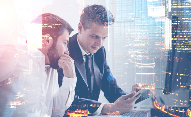 istock Two businessmen in office, cityscape 1132798092