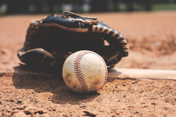 istock Baseball and glove on field 1132798123