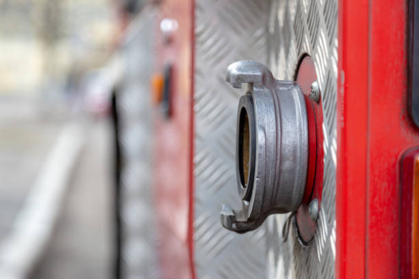 istock Closeup on firefighters car part with water pump valve. Shallow focus. Background with copy space. Disaster illustration concept. 1132799588