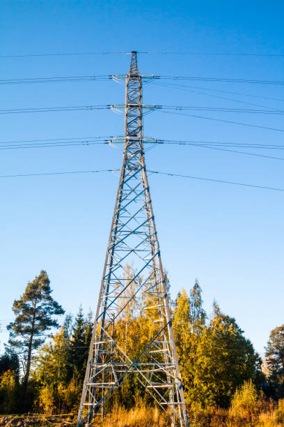 istock High-voltage power line tower on sky background at autumn in Finland. 1132799595