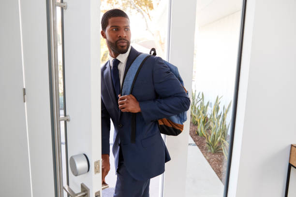istock Businessman Wearing Suit Opening Door Leaving Home For Work 1132799832
