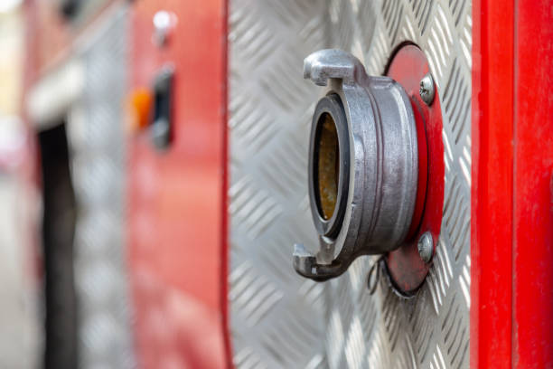 istock Closeup on firefighters car part with water pump valve. Shallow focus. Background with copy space. Disaster illustration concept. 1132800418