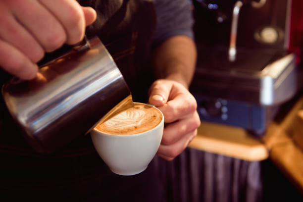 istock Coffee Latte Barista making pattern in a cup of coffee shop. 1132807751
