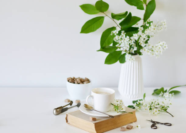 istock Vase with Flowers Bird Cherry Tree, Cup with Coffee 1132808764