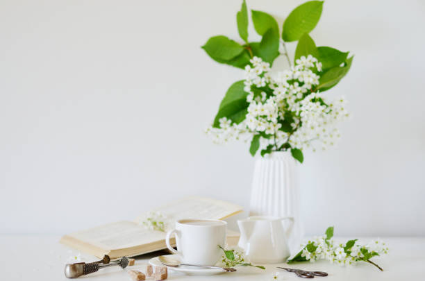 istock Vase with Flowers Bird Cherry Tree, Cup with Coffee 1132808788
