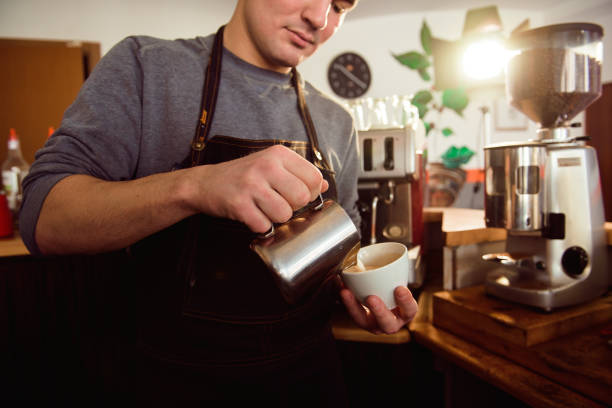 istock Coffee Latte Barista making pattern in a cup of coffee shop. 1132809686