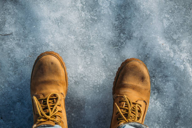 istock Stylish boots for hiking on ice. Winter concept with copy space 1132810398
