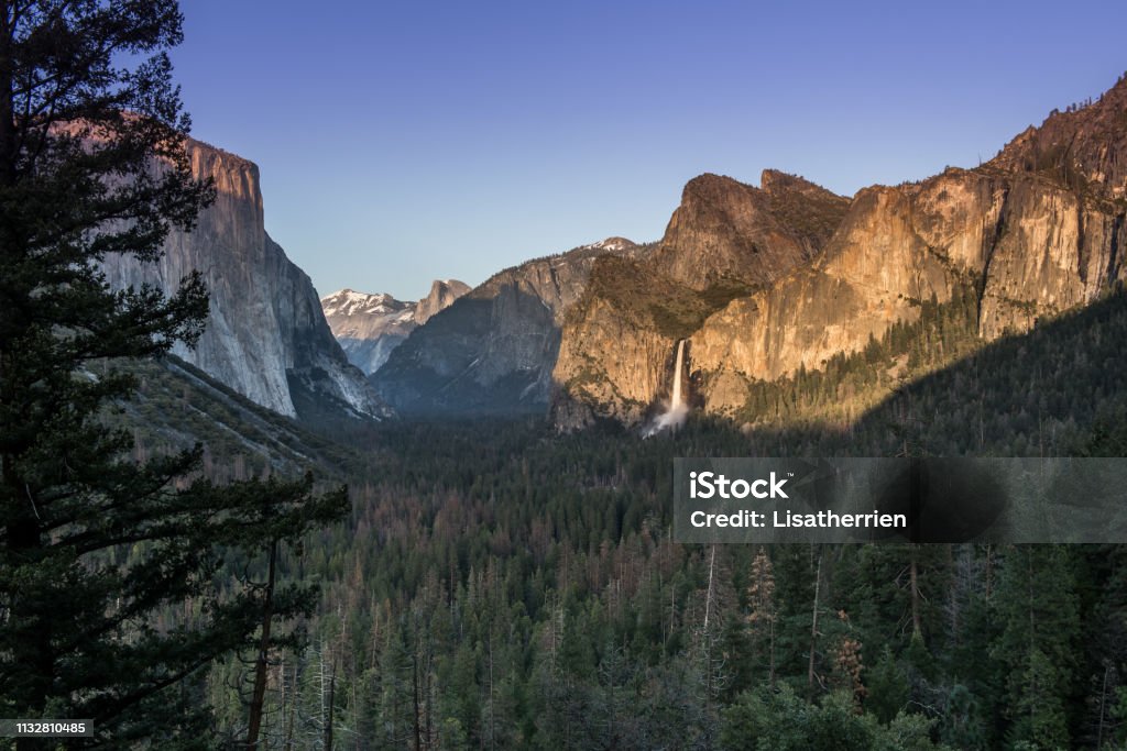 Yosemite national park waterfall entrance Yosemite waterfall national park waterfall on a sunset with forest foreground California Stock Photo