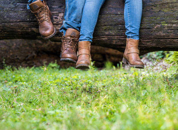 Legs of couple in love in park stock photo