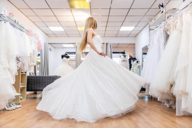 istock Pretty bride dancing in bridal shop 1132811032