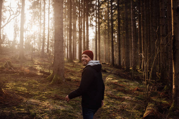 istock Man outdoors walking in spring nature landscape 1132812077