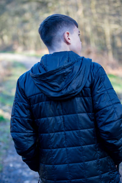 istock Teenage boy outside on a bright Spring day 1132812336