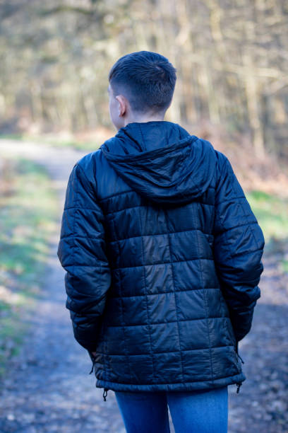 istock Teenage boy outside on a bright Spring day 1132813684