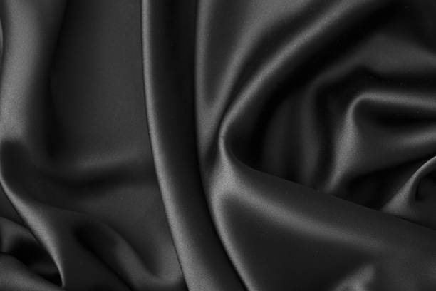 istock Black luxury wavy rippled glossy silk drapery cloth fabric 1132813962