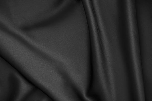 istock Black luxury wavy rippled glossy silk drapery cloth fabric 1132814028