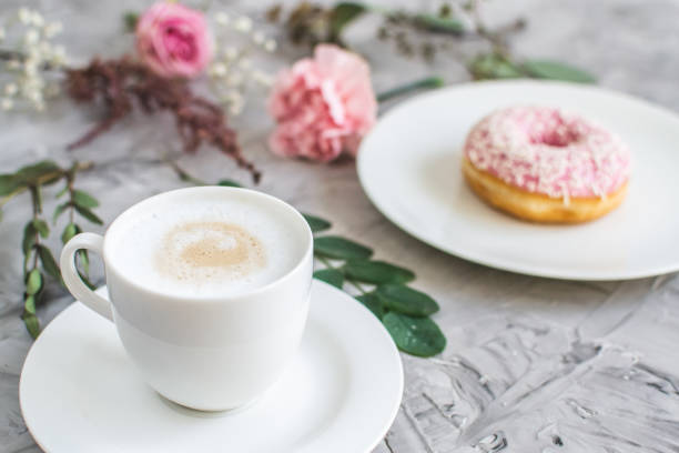 istock Cup with cappuccino, doughnut, morning concept 1132814085