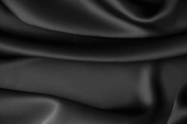 istock Black luxury wavy rippled glossy silk drapery cloth fabric 1132814690