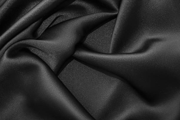 istock Black luxury wavy rippled glossy silk drapery cloth fabric 1132816312