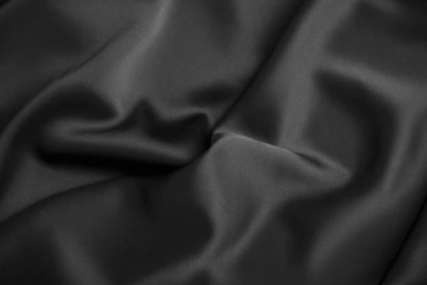 istock Black luxury wavy rippled glossy silk drapery cloth fabric 1132817739