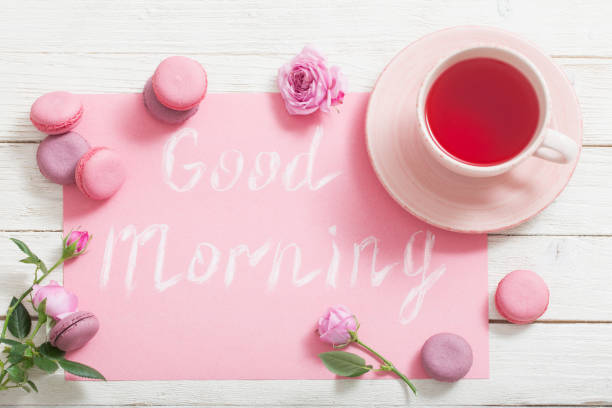 istock cup of tea and pink macaroons on white wooden table 1132818015